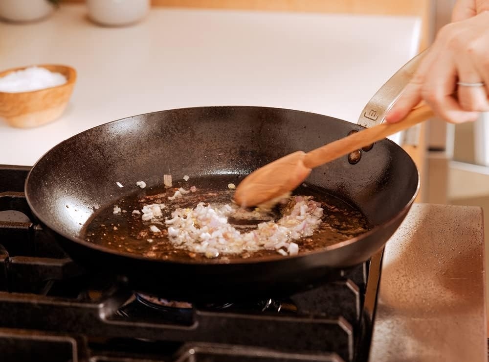 frying onions in pan